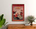 Vintage reclameposter Grandes Galeries modernes, Agen, ingelijst boven een houten dressoir tussen planten.