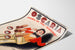 Vintage reclameposter Oscaria, schoenen, gepresenteerd op een gebogen blad, perspectivisch gezien.