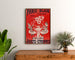 Vintage reclameposter Paris–Dijon, speelgoed en nieuwjaarsgeschenken, ingelijst boven een houten ladekast, tussen planten.