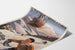 Vintageposter Saint-Gervais, Mont-d’Arbois, gepresenteerd op een gebogen vel, perspectivisch gezien.