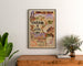 Vintage poster Touraine, kastelen van de Loire, ingelijst boven een houten ladekast, tussen planten.